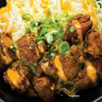 Fried Chicken Karaage Bowl · Japanese Fried Chicken Karaage on a bed of white rice and shredded cabbage. Topped with Japa...