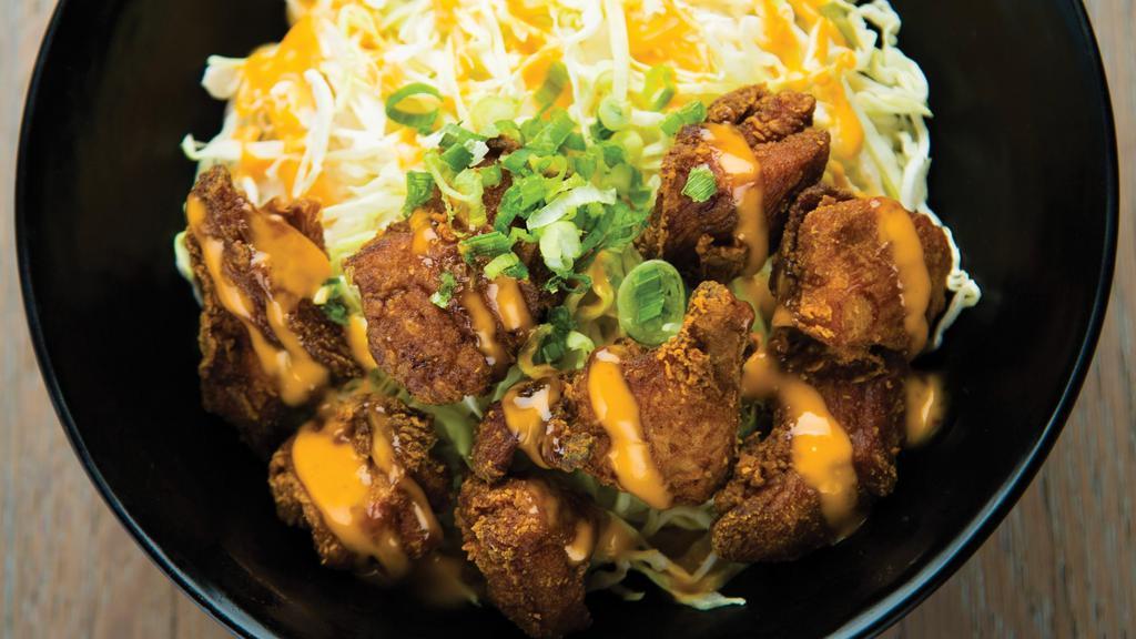 Fried Chicken Karaage Bowl · Japanese Fried Chicken on a bed of White Rice and Shredded Cabbage. Topped with Chopped Green Onions. Served with Japanese Chili Mayo.