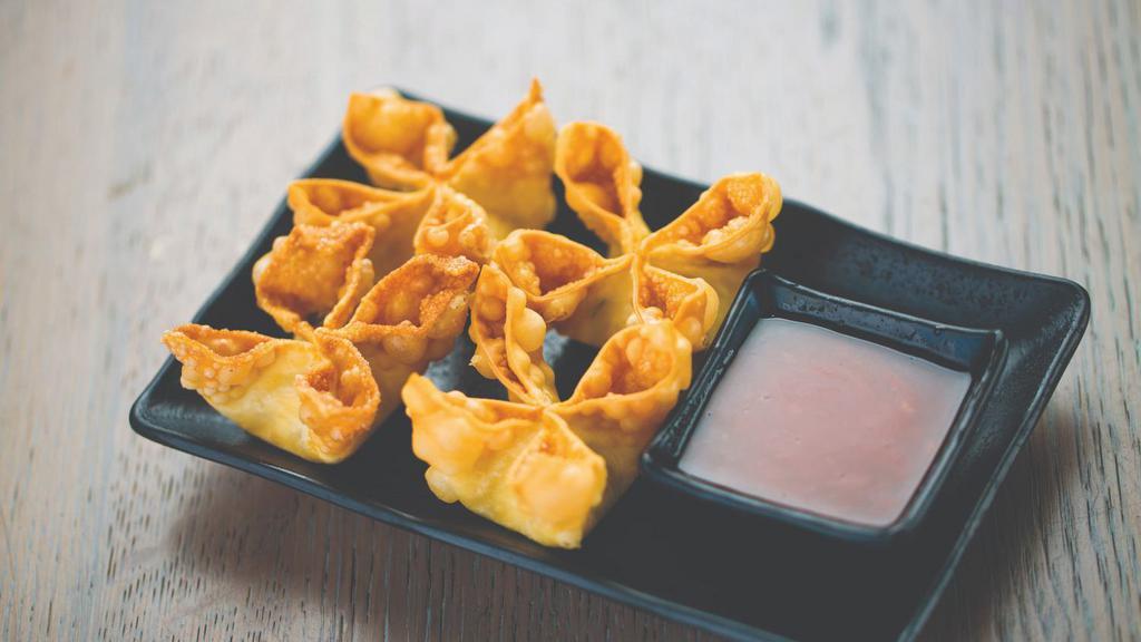 Fried Cheese Wontons · Crispy fried wontons filled with cream cheese and green onions. Served with sweet chili sauce.