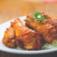 Miso Chili Wings · Five (5) fried chicken wings coated in our sweet & spicy Miso Chili sauce.