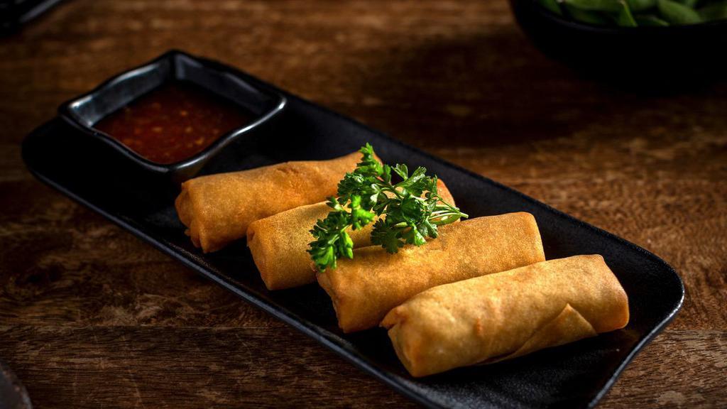 Vegetable Spring Rolls · Four (4) Fried Vegetable Spring Rolls with Sweet Chili Dipping Sauce on the side.