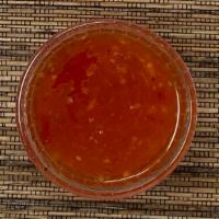 Sweet Chili Sauce · A mildly spicy sauce perfect for dipping spring rolls or fried cheese wontons. Photo is mean...