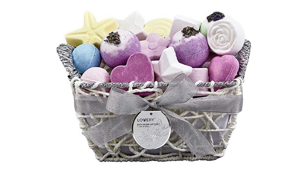 The Bath Bomb Basket (17 Pcs) · Revive Mom's spirit with a luxurious basket with 17 bath bombs! Beautifully packaged in a chic white and silver shimmer gift basket, this bath gift set has everything one needs to feel pampered and loved. With its various shapes, scents, and colors it makes for an extraordinary gift and adds a lovely touch to the bathroom.
2 X Heart – Raspberry Scent, 2 X Balls – Lavender Scent, 1 x Ball – Ocean Bliss Scent, 1 x Swirl – Honey Almond Scent, 1 x Ball - Magnolia Jasmine Scent, 2 x Cylinder – Pink Grapefruit Scent, 1 x Star – Sunflower Scent, 2 x Balls – Vanilla Scent, 1 x Square – Strawberry Scent, 1 x Star – Vanilla Scent, 1 x Flower – Pink Grapefruit Scent, 1 X Square – Vanilla Scent, 1 X Flower – Vanilla Scent.
Enriched with Shea Butter which nourishes & moisturizes skin. Enriched with Vitamin E which provides age-reversing antioxidant properties.100% Paraben-Free and Cruelty-Free.