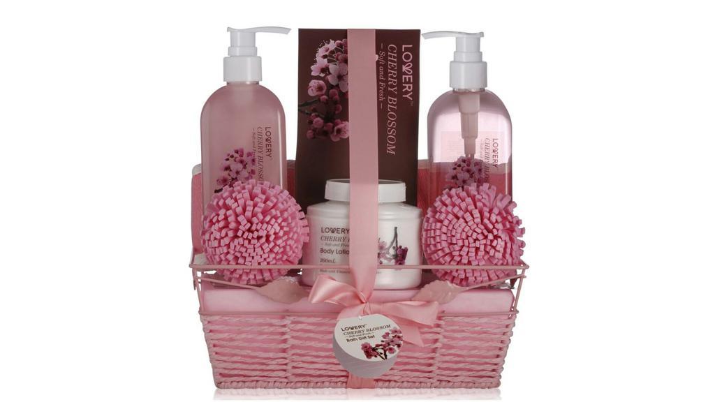 Cherry Blossom Home Spa Kit · Revive your spirit with a luxurious at-home spa cherry blossom gift treatment! Beautifully packaged in a hand weaved basket, perfect for decor and storage. Products are enriched with Shea Butter which nourishes & moisturizes skin. Enriched with Vitamin E which provides age-reversing antioxidant properties. 100% Paraben-Free and Cruelty-Free. This gift set includes: Sudsy Shower Gel provides a long-lasting scent (300ml), Soothing Bubble Bath lets you relax to the max (300ml), Rich, Emollient Lotion replenishes moisture (200ml), Energizing Bath Salt detoxifies your body (100g), 2 Soft Bath Poufs, Exfoliating Loofah Back Scrubber.  About the Fragrance: This beautiful fragrance contains soft, sheer floral notes and evokes a vision of blooming buds gently swaying in the breeze. Float away to paradise with the enchanting bouquet of Cherry Blossom as you lavish your body with our deluxe bath products. You'll leave feeling glamorous and refreshed, ready to take on the day!