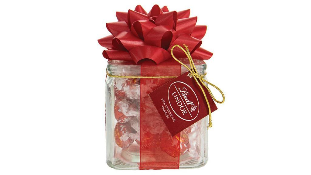 Chocolate Cube · Candy Cube includes 1 reusable glass jar filled with candy packed with a sheer organza ribbon and 1 large satin bow. Filled with Lindt® Lindor® truffles. Glass cube measures 4 inches tall by 4 inches wide by 4 inches deep.