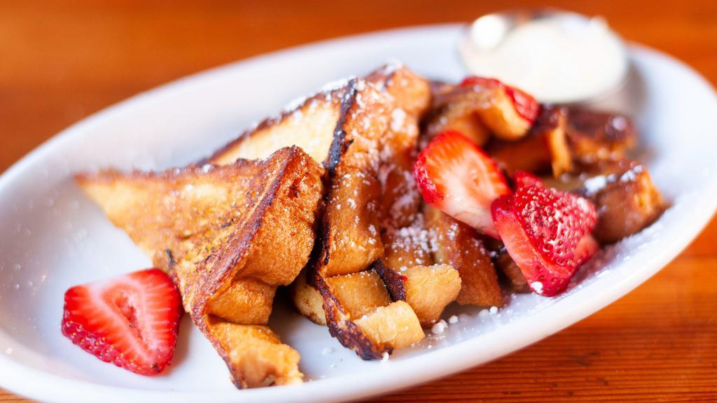 French Toast (3) · Served with powdered sugar and maple syrup.