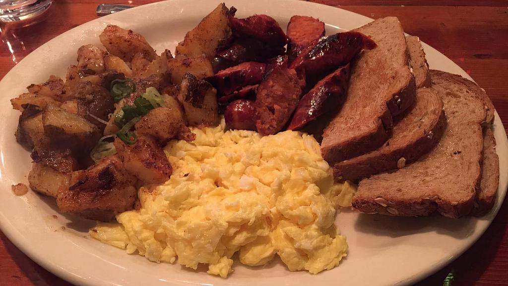 Linguica & Eggs · 2 scrambled eggs served with Portuguese linguica sausage, home fries and sourdough toast.