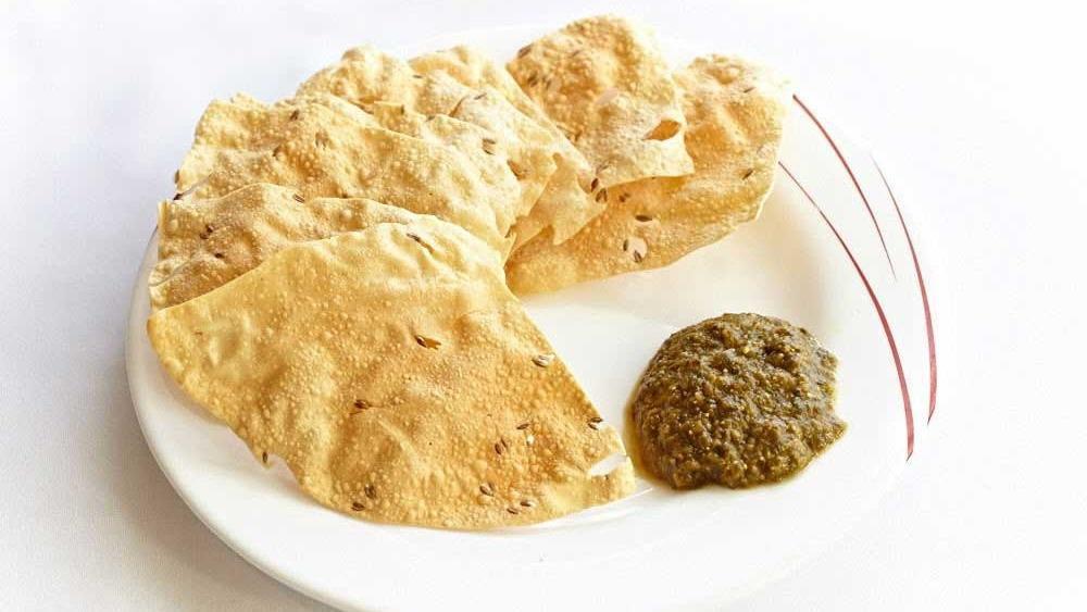 Papadam · Two pieces per order. Indian lentil wafers. Served with mint-cilantro sauce.