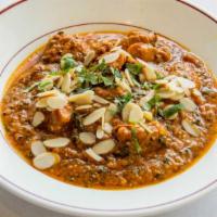 Kadhai Gosht · Gluten free. Boneless cubed lamb cooked in a thick, spicy curry sauce, with nuts.