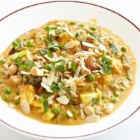 Navrattan Korma · Vegetables and paneer cheese in a creamy curry sauce with nuts and raisins.