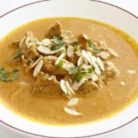 Lamb Korma · Boneless cubed lamb in a creamy curry sauce, topped with slivered almonds.