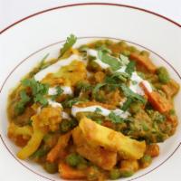 Sabzi Rangarang · Vegan. cauliflower, green beans, broccoli, carrots, and peas, simmered in a sauce made with ...