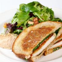 Chicken Milanese* · Crusted chicken, chipotle aioli, tomato, bacon, and spinach.