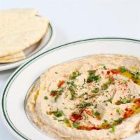 Hummus · Vegan. Garbanzo beans, tahini, and spices.