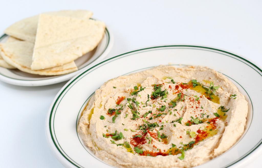 Hummus · Vegan. Garbanzo beans, tahini, and spices.