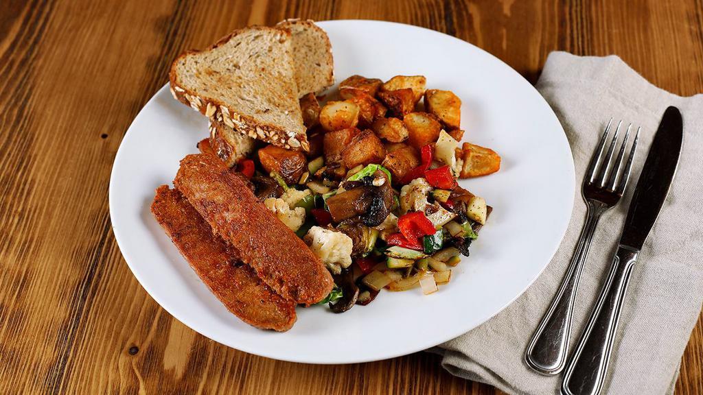 Vegan Breakfast Plate · vegan sausage, veggie hash, house potatoes, multigrain toast, jam.