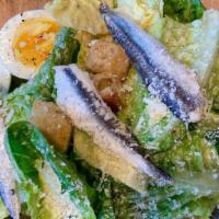 Caesar · little gem lettuce, garlic croutons, soft-cooked egg, anchovies, parmigiano . *dressing serv...