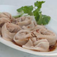 #1.3. Spicy Wontons (8 Pieces) · Spicy. Soy protein, cabbage, onion, ginger wrapped in wonton skin, served in spicy sauce.