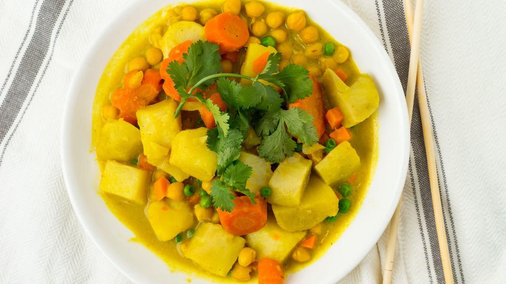 #8.7. Lucky Curry · Spicy, gluten-free. Cauliflower, peas, carrot, garbanzo beans, potato, snow peas in a yellow curry sauce.