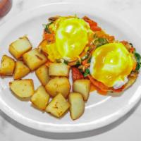 Eggs Popeye · Two eggs poached on an English muffin with spinach, mushrooms, tomato and Hollandaise with h...