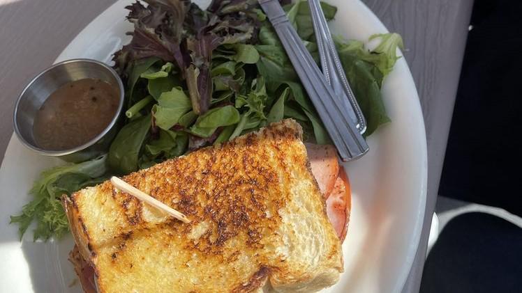 Grilled Ham & Cheese Sandwich · Ham, Swiss cheese and tomato on Aeme sourdough.