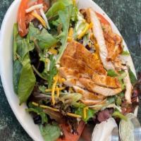 Chicken Fajita Salad · Grilled marinated chicken cheddar cheese on top of the fresh garden with your choice of soup...