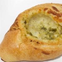 Jalapeño Cheese Bread · Crisp French Loaf Rolled with 3 Cheeses and Creamy Jalapeño Sauce.