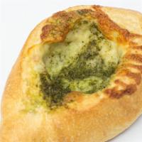 Pesto Bread · Crisp French Loaf Rolled with Basil Pesto & Pizza Cheese Mix.