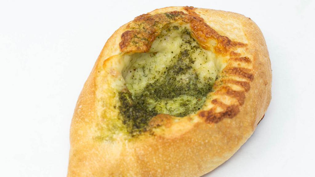 Pesto Bread · Crisp French Loaf Rolled with Basil Pesto & Pizza Cheese Mix.