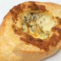 Int'l Cheese Bread · Crisp French Loaf Rolled with Gruyere, Fontinella, & Provolone Cheese.