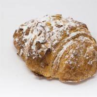 Croissant Amand · A Buttery, Flaky Croissant Filled with our Homemade Almond Paste, Topped With Sliced Almonds.