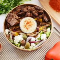 Lamb Rice Bowl · Rice over greek salad with feta cheese and olives accompanied with roasted veggie mix, baked...