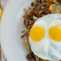 Bird's Nest · Housemade ground beef scrambled with fresh hash browns, onions, melted jack and cheddar chee...