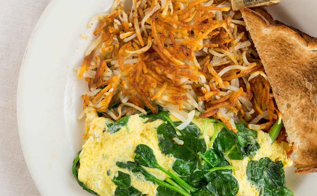 Veggie Omelet · Mushrooms, bell peppers, onions and spinach.
