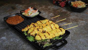 Satay Chicken · Sliced chicken skewers marinated with coconut milk and spices, charbroiled, served with cucu...