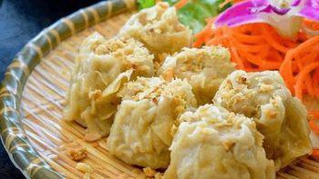 Steamed Dumpling · Homemade steamed dumpling filled with minced pork, water chestnut and garlic topped with spi...