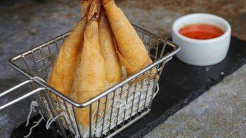 Prawns in a Blanket · Deep fried marinated prawns rolled in spring roll wrappers, served with sweet and sour sauce.