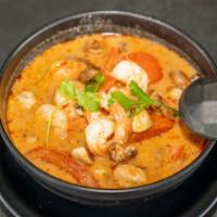 (Large) Tom Yum · Hot and sour soup with lemongrass, galangal, kaffir lime leaf, chili paste, mushroom, onion,...