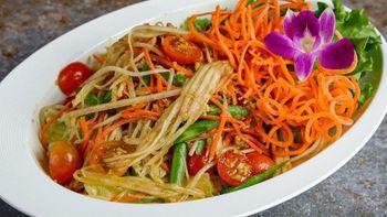 Papaya Salad · Shredded green papaya, tomato, green bean, peanuts and carrot tossed in a Thai Style house d...