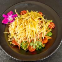 Mango Salmon Salad · Grilled Salmon accompanied by roasted coconut flake, carrot, tomato, and shredded mango toss...