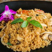 Tom Yum Fried Rice · Stir-fried rice seasoned with Thai Chili Paste & Tom Yum sauce, onion, tomato, mushroom, ser...