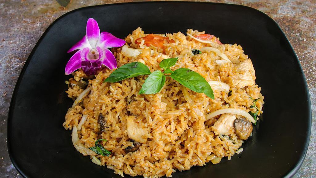 Tom Yum Fried Rice · Stir-fried rice seasoned with Thai Chili Paste & Tom Yum sauce, onion, tomato, mushroom, served with you choice of meat.   Please note: It’s NOT gluten free dish, but we could make it gluten free upon the request.