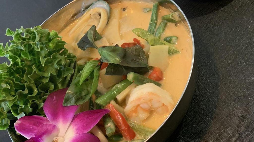 Red Curry · This paste gets its rich color from its prime ingredient-fresh red chilies, Our red curry is classically prepared with coconut milk, basil, bamboo shoot, bell pepper, served with your choice of meat.   Please note: This dish is gluten free.