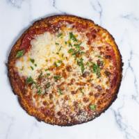 Cheesus Crust · Delicious and healthy vegan pizza crust topped with marinara sauce and vegan mozzarella chee...