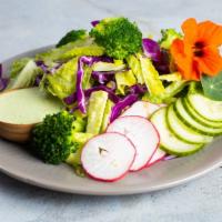 Lettuce Romaine Calm · Romaine, red cabbage, broccoli, radish, cilantro, and jalapeno cilantro dressing.