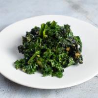 Kale to Action · Lacinato kale sautéed in olive oil, garlic, and finished with a squeeze of lemon.