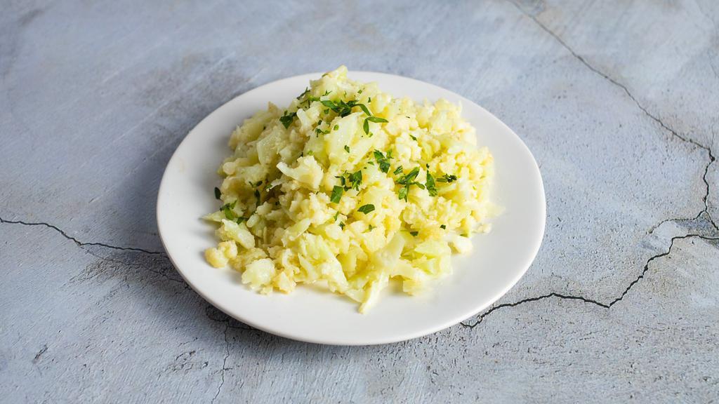 Garlic Cauliflower Rice · Minced cauliflower sautéed with garlic and butter.