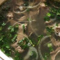 1 Special Pho · Beef noodle soup with fillet mignon, rare steak slices, beef brisket, meatballs, onions, and...