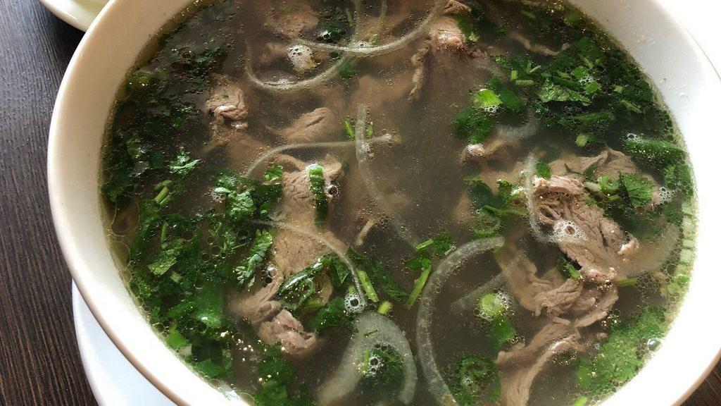 1 Special Pho · Beef noodle soup with fillet mignon, rare steak slices, beef brisket, meatballs, onions, and scallions.