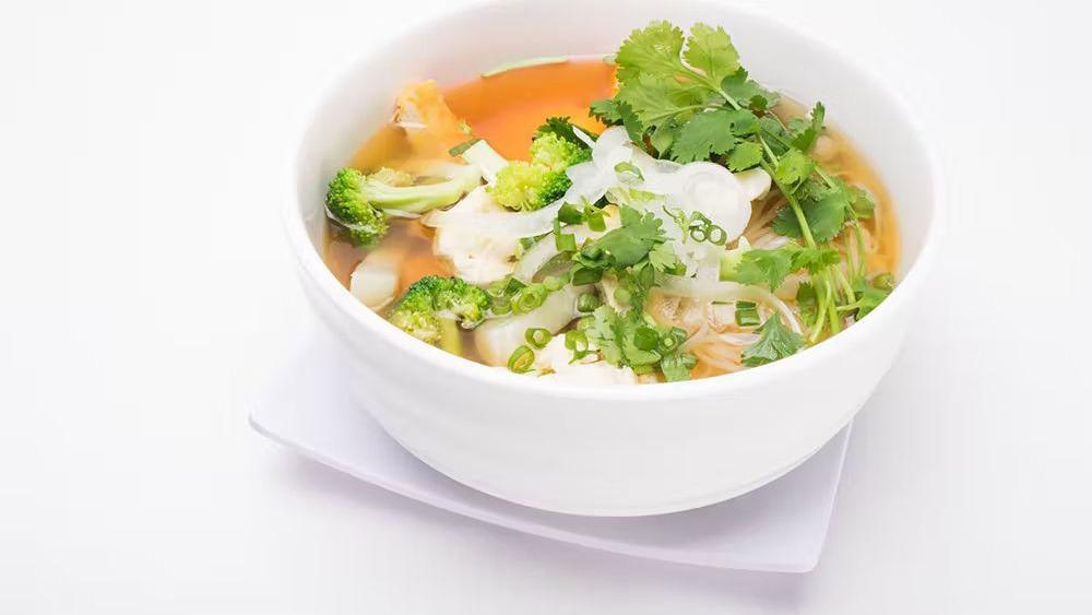 6 Vegan Pho · Veggie noodle soup with broccoli, tofu, cauliflower, mushroom, carrot, daikon, onions, and scallions.